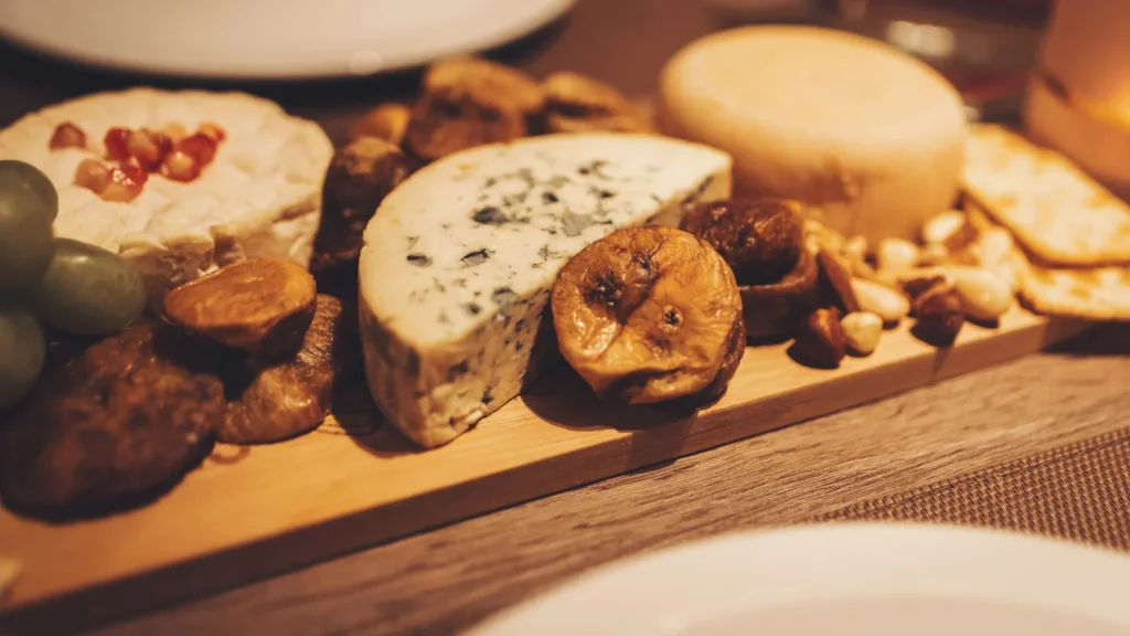 Cheese board with dried figs, blue cheese, nuts and crackers, one of the easiest dried fig recipes