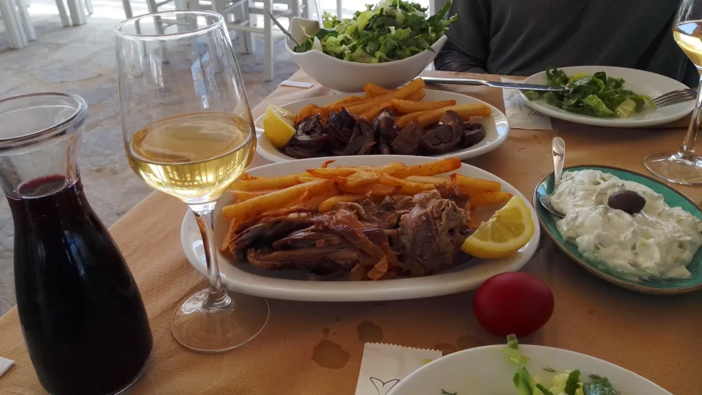 An Easter Sunday meal at a restaurant on Paros: tzatziki, salad, kokoretsi and red wine