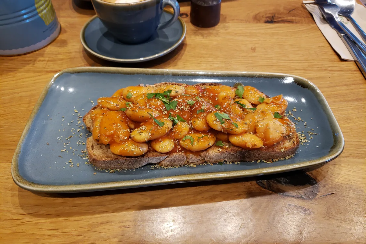 Greek giant baked beans in tomato sauce served on toast