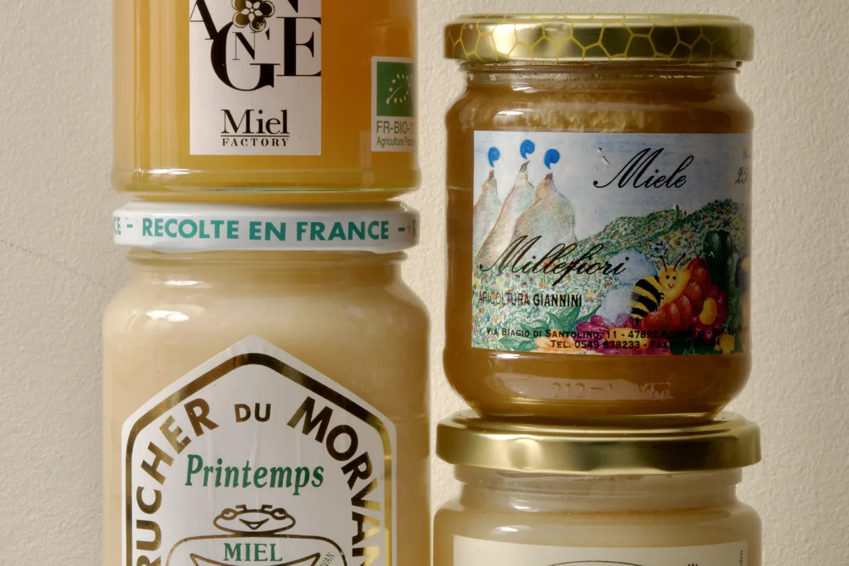 Assorted jars of creamed and liquid honey from Europe