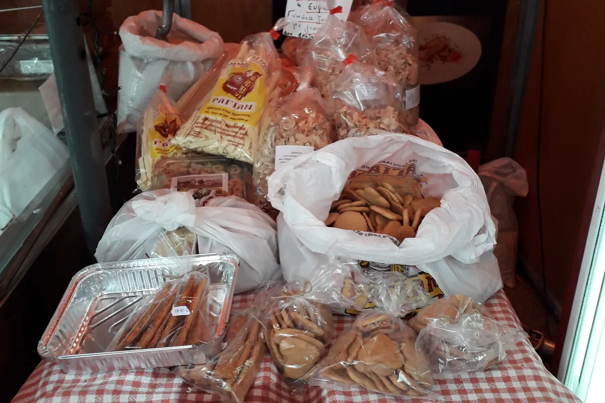 Bags of homemade koulourakia and pasta for sale at a Pontic Greek food stall in Athens