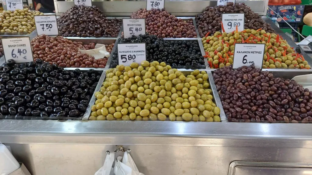 A market stand selling many types of Greek olives at Kapani Market in Thessaloniki