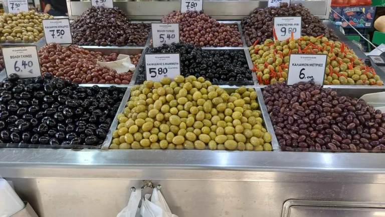 A market stand selling many types of Greek olives at Kapani Market in Thessaloniki