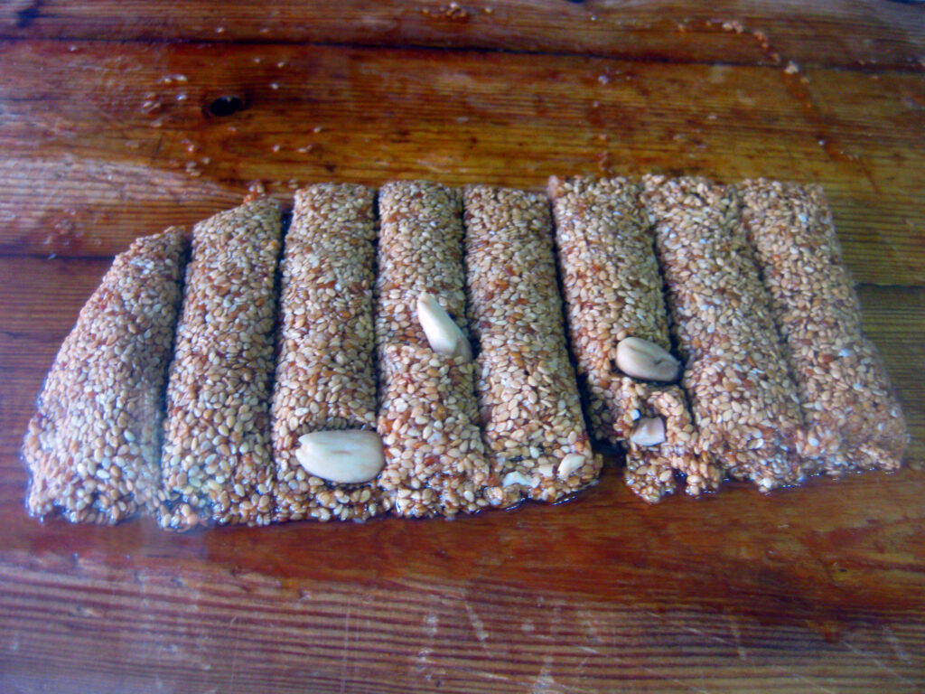 Sesame pasteli bars topped with nuts