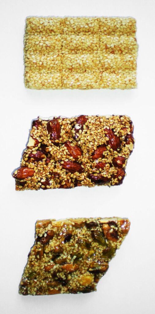 Three sesame and nut bars arranged vertically