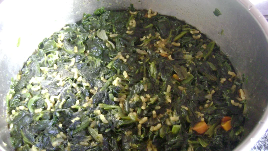 A pot of spanakorizo, Greek spinach rice with herbs