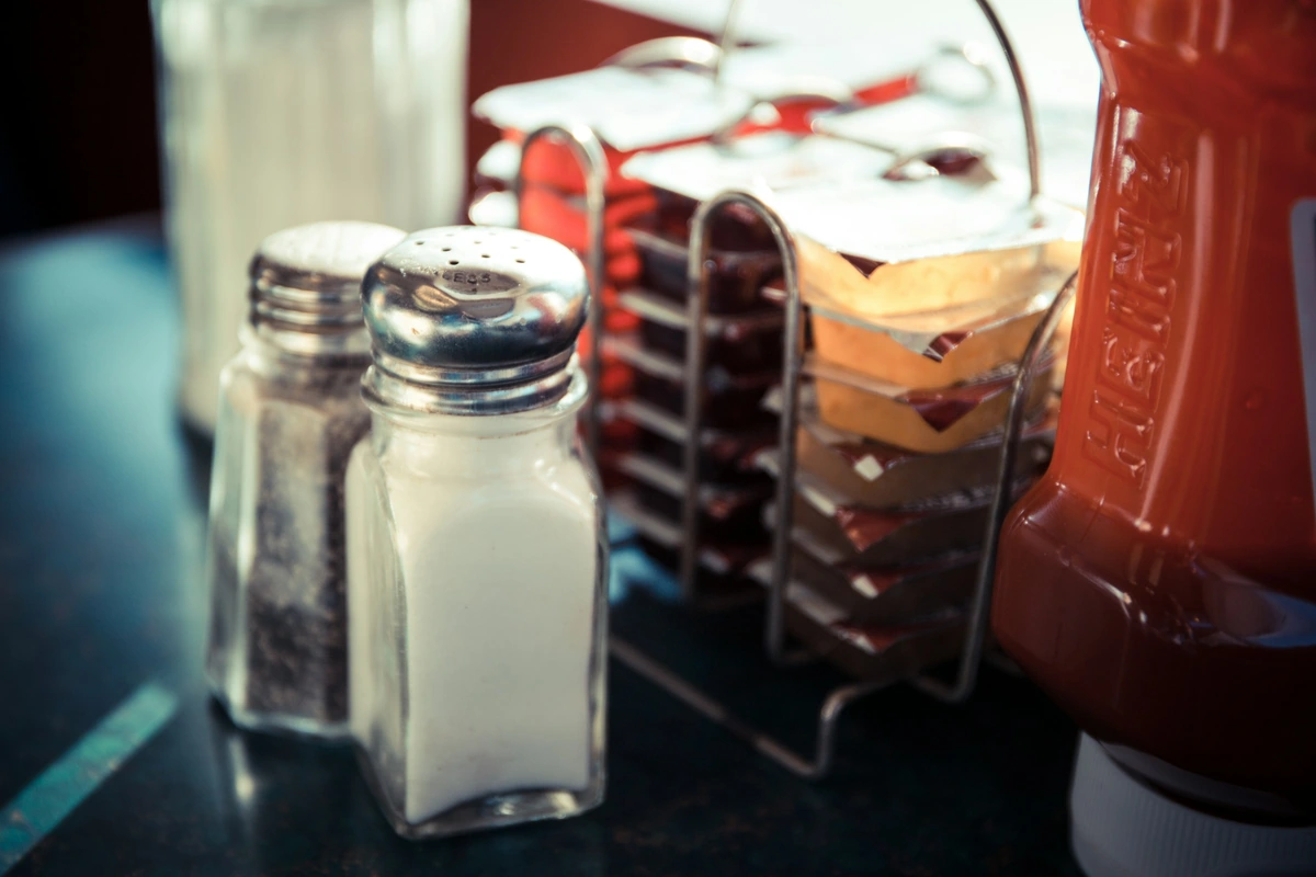 Salt and pepper shakers on a diner table