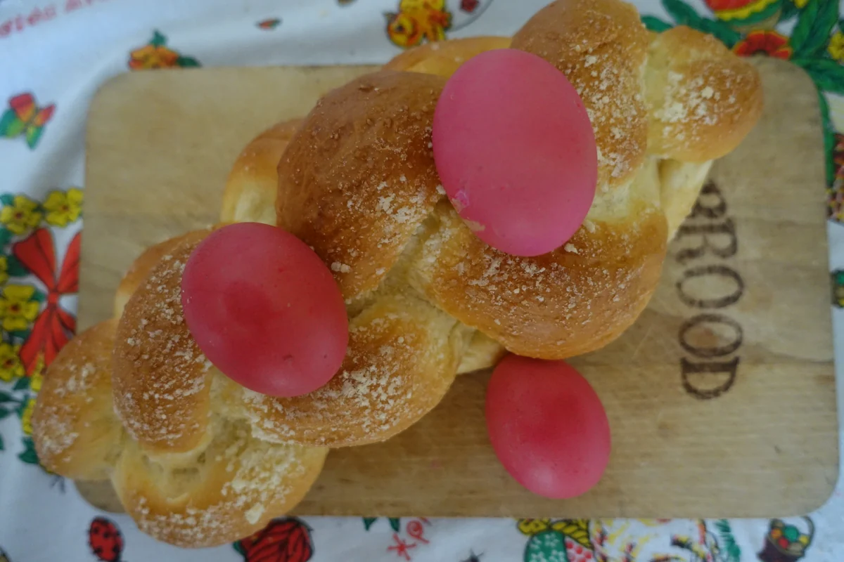 A braided tsoureki studded with red-dyed eggs, the traditional Greek Easter bread