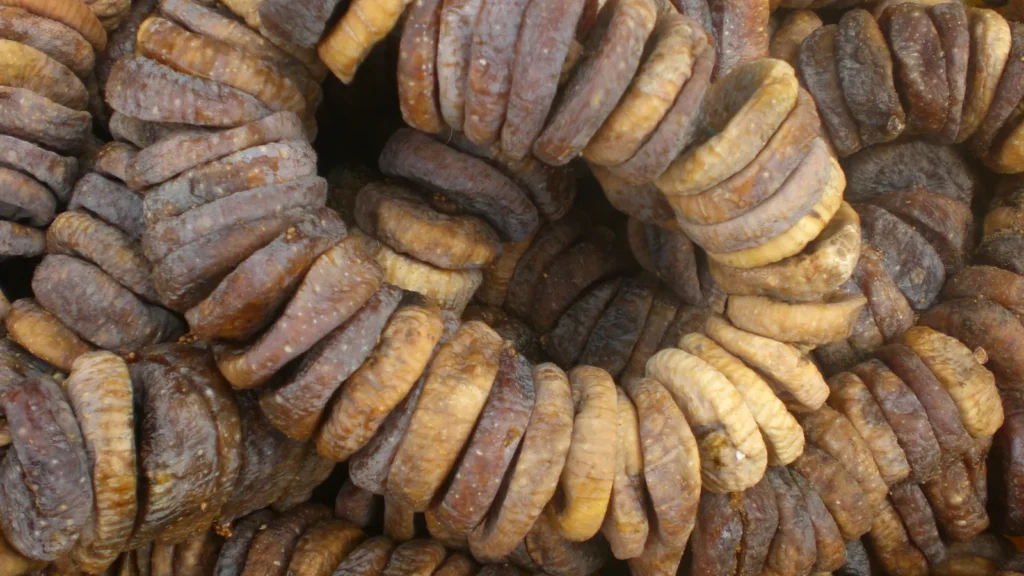 Dried figs threaded on a string, raising the question do you remove stems from dried figs