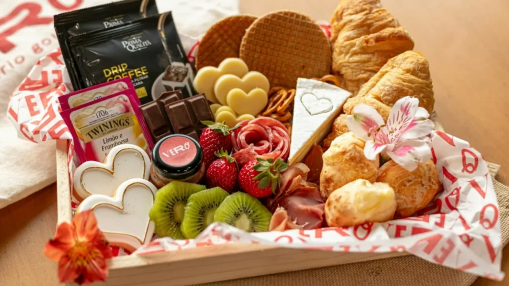 Wooden tray of assorted treats wrapped as a food gift basket