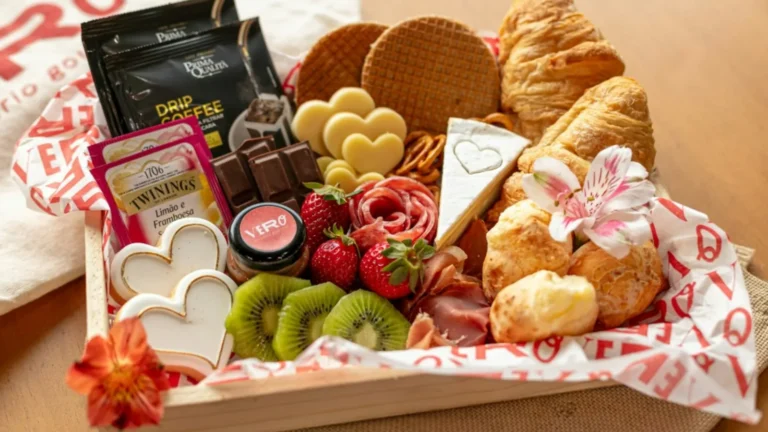 Wooden tray of assorted treats wrapped as a food gift basket