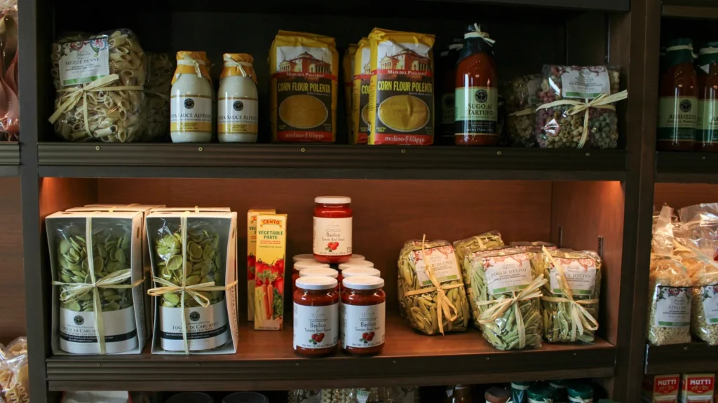 Pantry shelves of jars and packaged foods, the subject of these Greek pantry guides