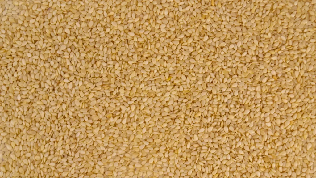 Close-up of golden sesame seeds, the first step in how to toast sesame seeds for pasteli